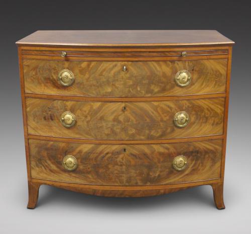 A George III period mahogany & satinwood bow-fronted chest of drawers. Circa 1810