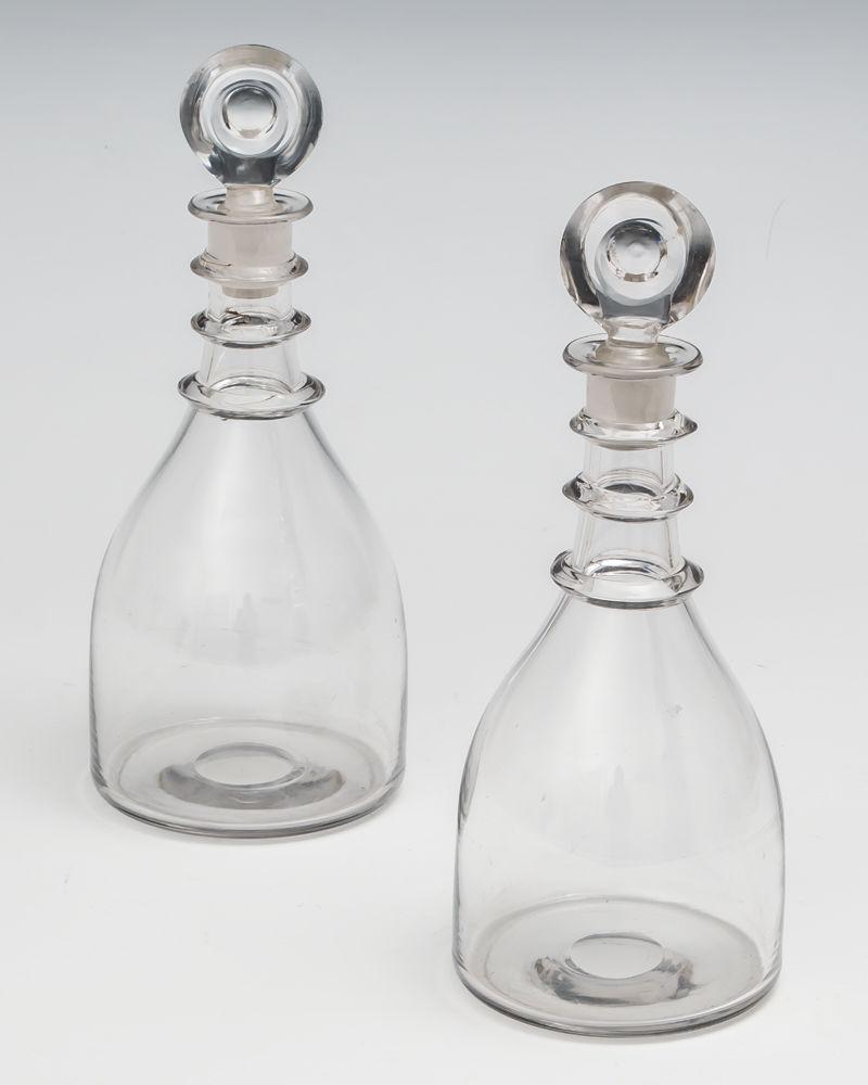 A pair of Georgian triple ring spirit decanters