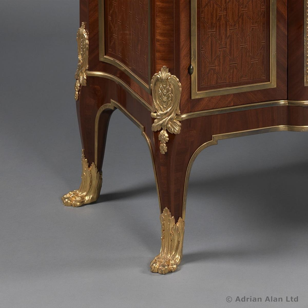A Marquetry Inlaid Side Cabinet With A Marble Top