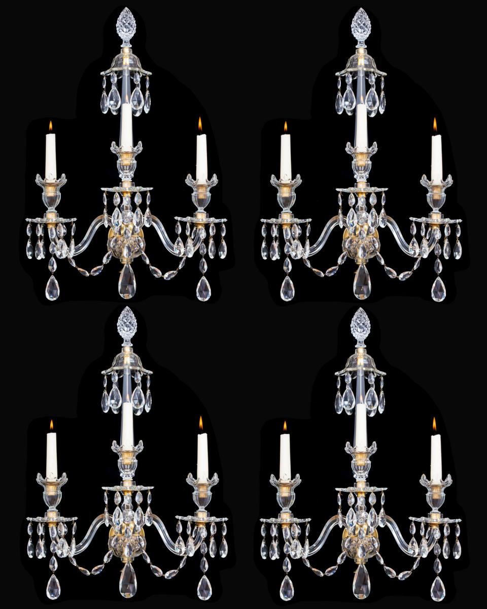 A SET OF FOUR ORMOLU MOUNTED CUT GLASS WALL LIGHTS IN ADAM STYLE, English Circa 1900