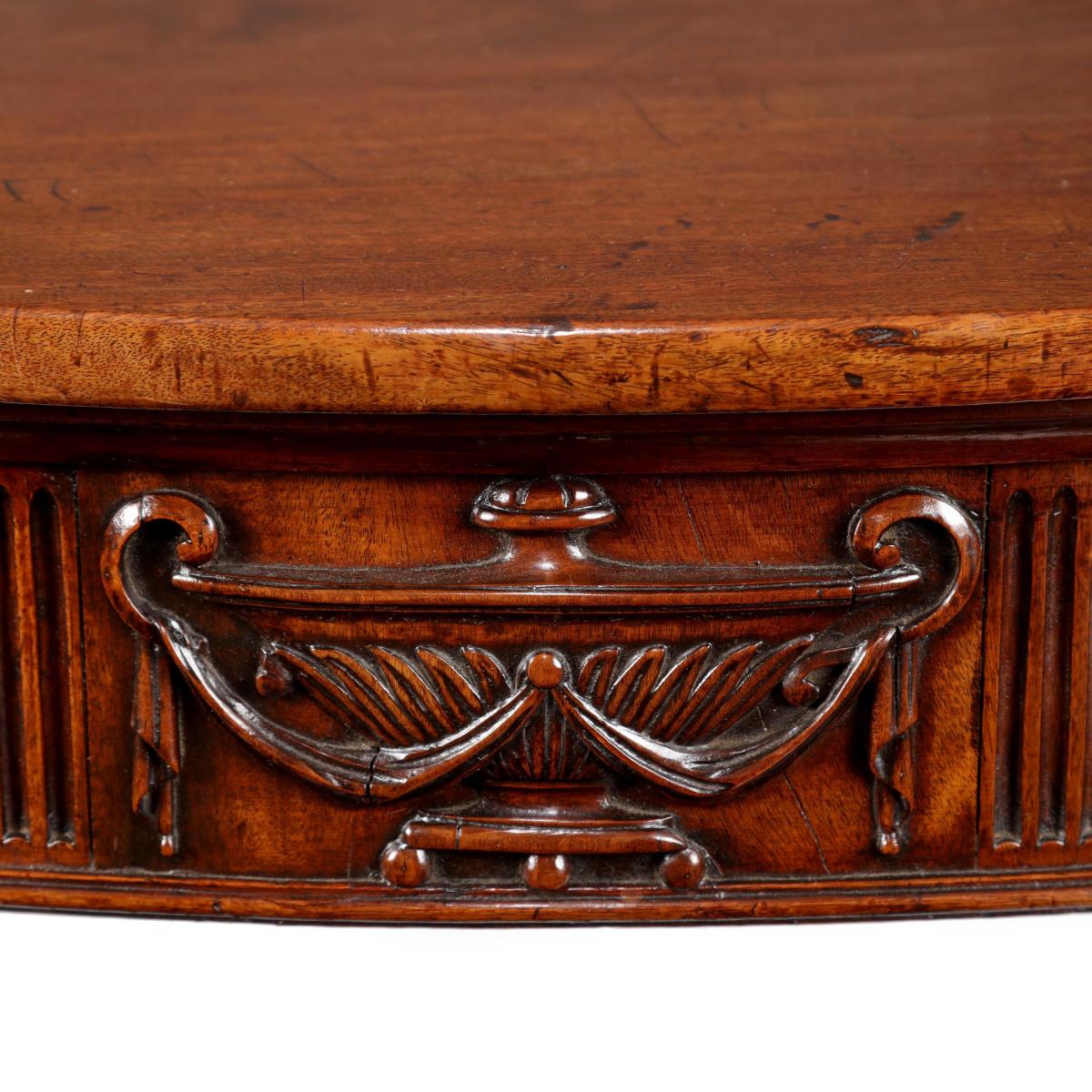 George III serpentine carved mahogany side table in the manner of Robert Adam