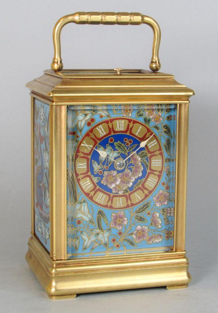  A Cannalée carriage clock with unusual enamelled panels