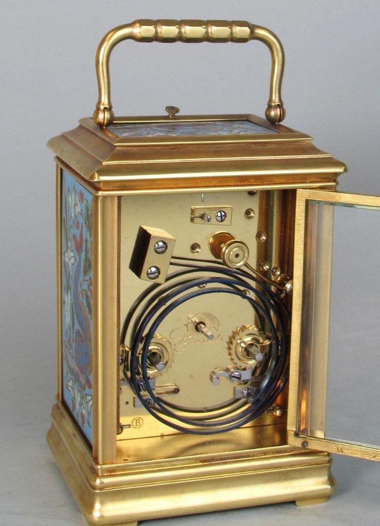 A Cannalée carriage clock with unusual enamelled panels backplate