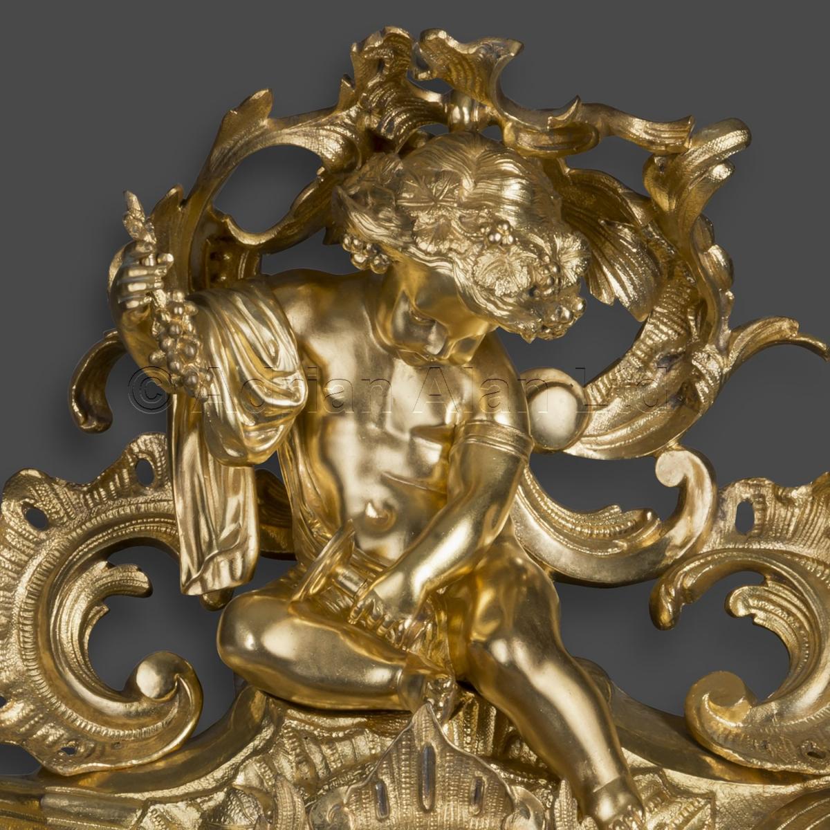 An Elaborate Louis XV Style Gilt-Bronze Cartel Clock
