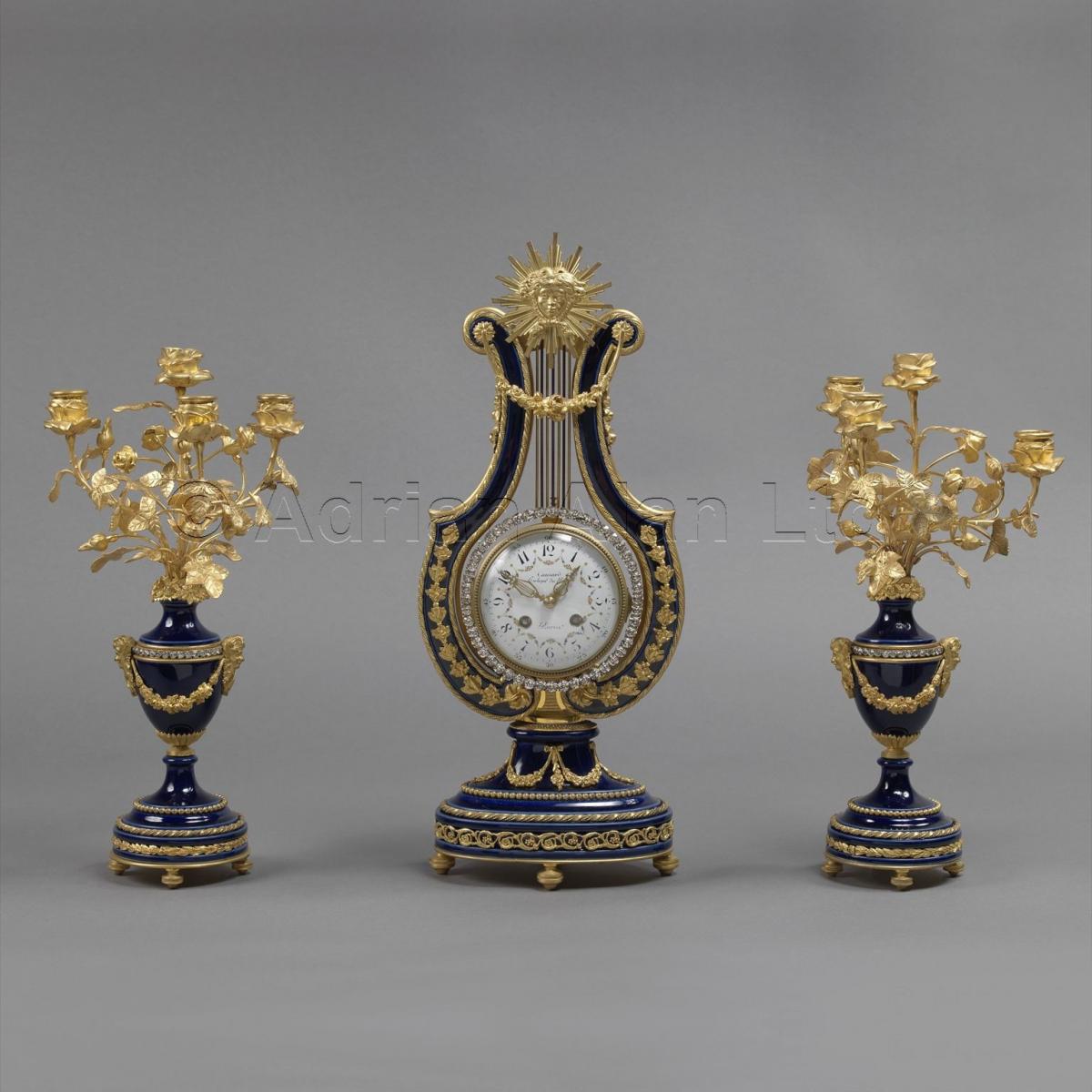 A Fine Louis XVI Style Cobalt Blue Porcelain Lyre Clock Garniture