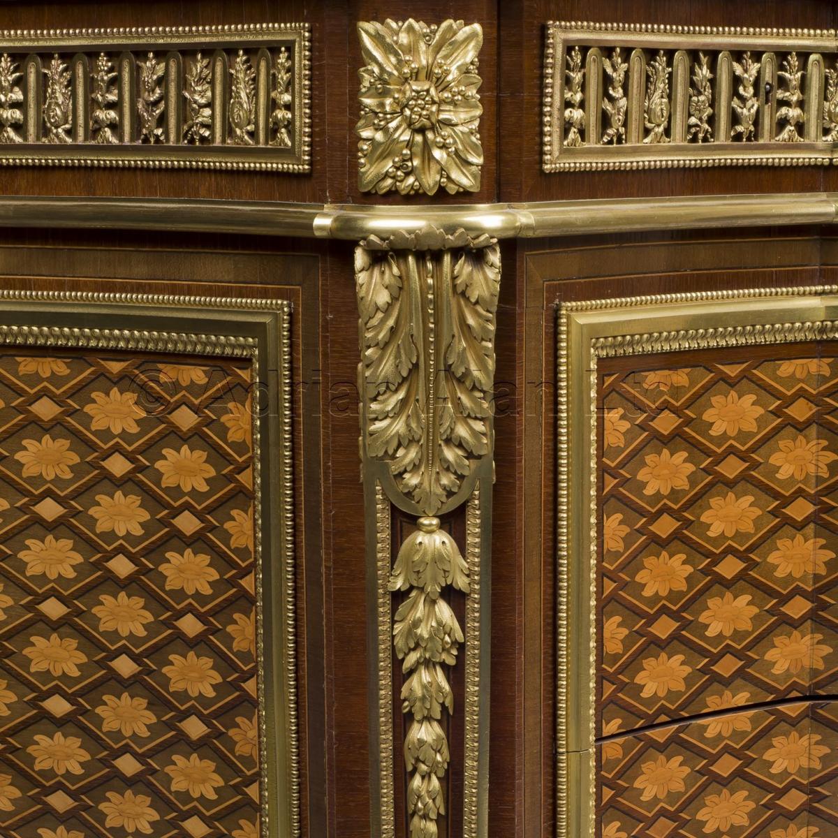 A Louis XVI Style Marquetry Commode after a model by Jean-Henri Riesener, by François Linke