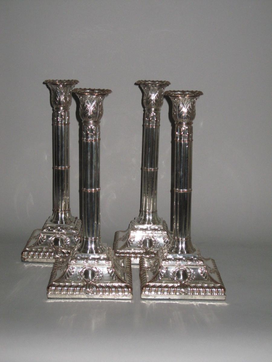 SET OF FOUR OLD SHEFFIELD PLATE SILVER CANDLESTICKS. GEORGE III, CIRCA 1765-1770