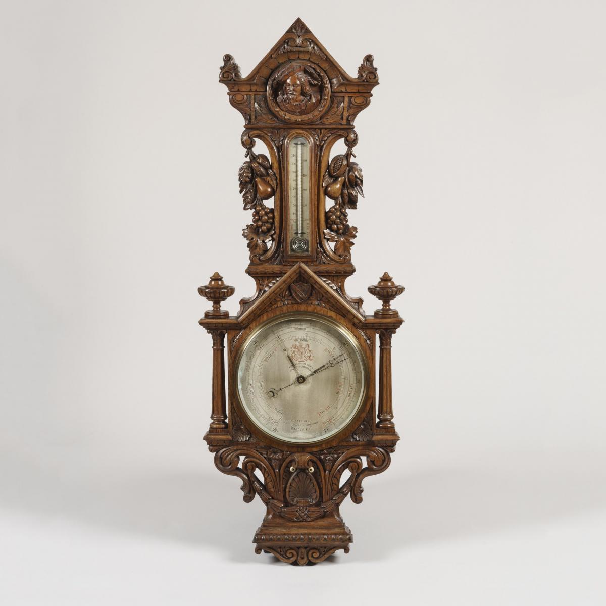 A Carved Oak Barometer by E. Cetti of Brook Street, London
