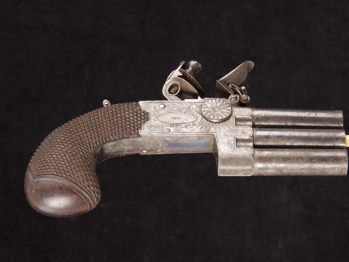 A rare flintlock pocket pistol with three barrels in line_e