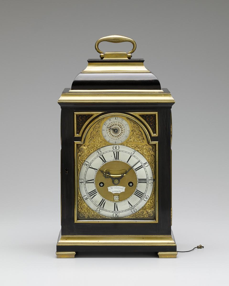 John Everell, London A fine Geo III brass bound ebony veneered table clock of small size