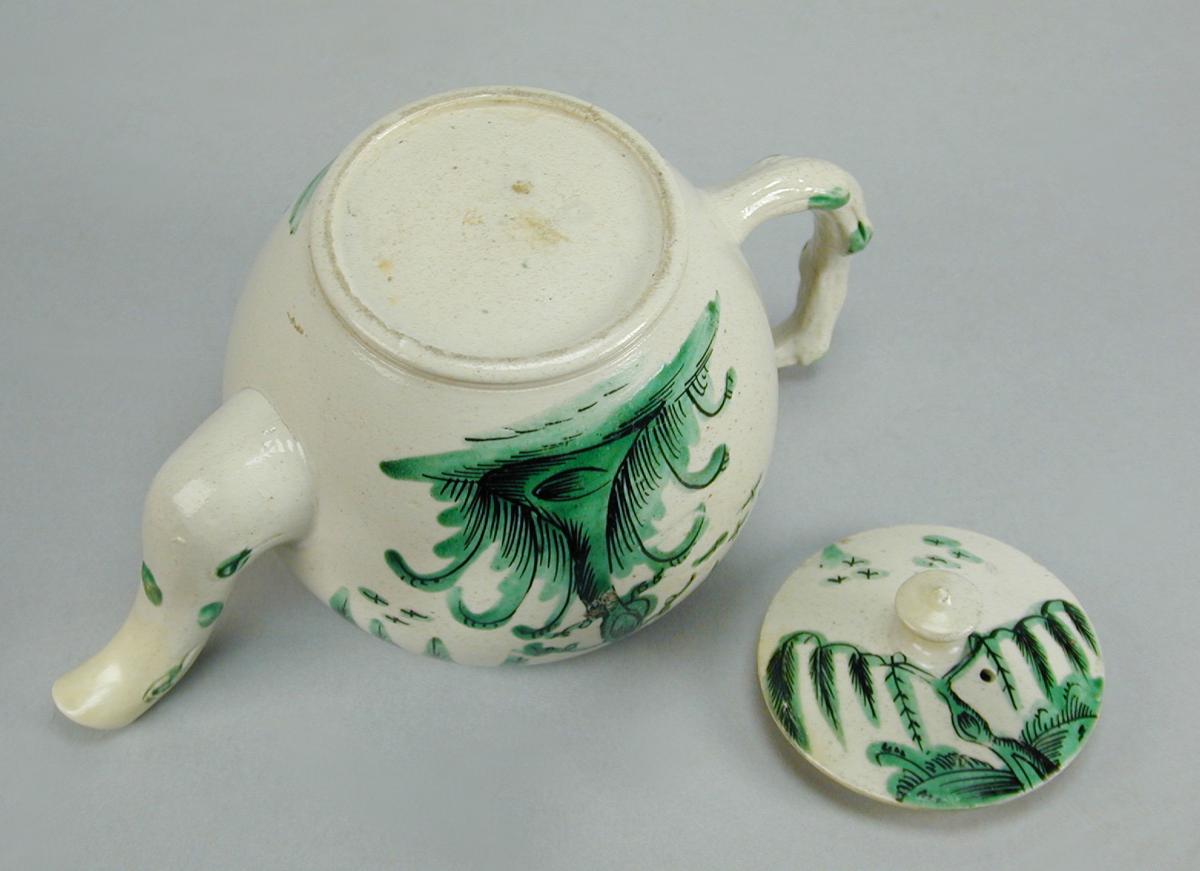 Staffordshire saltglaze teapot decorated in green and black, c.1770