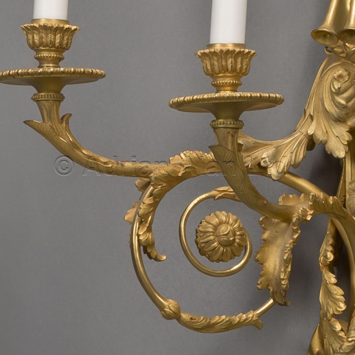 A Pair of  Louis XVI Style Three-Light Wall-Appliques After Jean Hauré