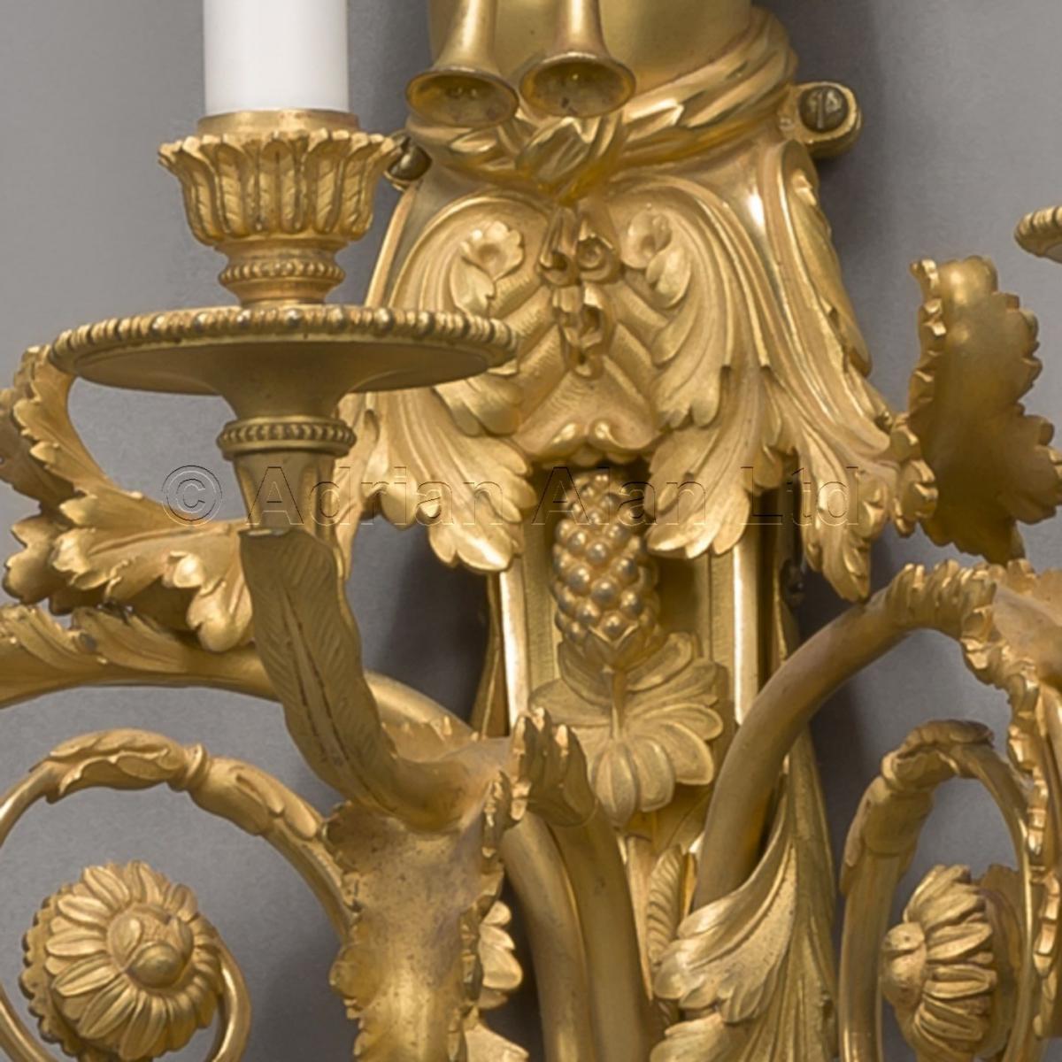A Pair of  Louis XVI Style Three-Light Wall-Appliques After Jean Hauré