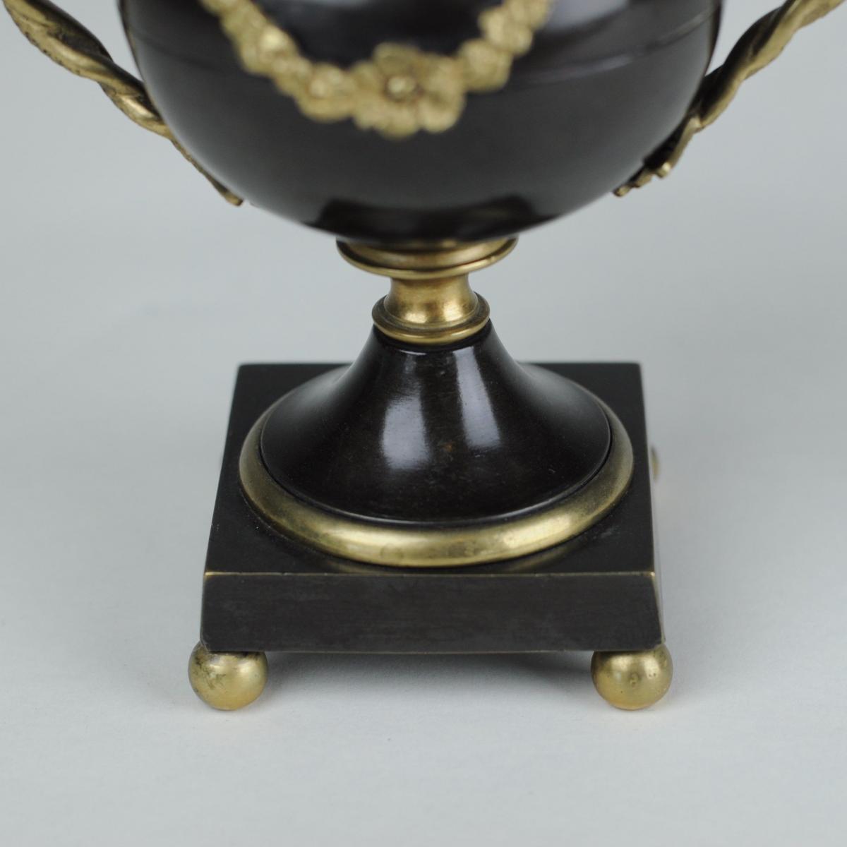 Bronze and ormolu vase shaped candlesticks or pastel burners