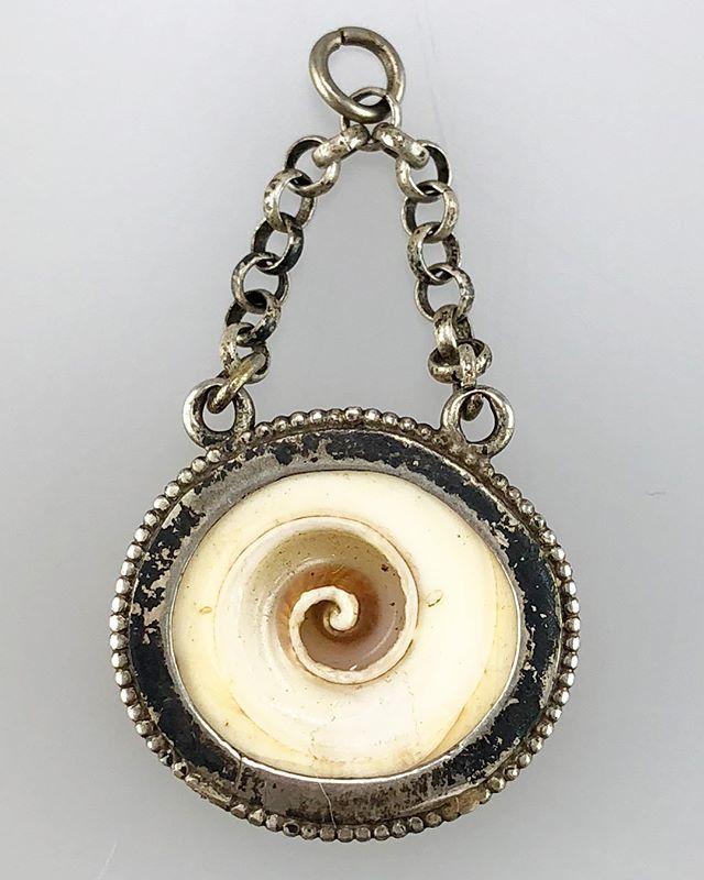 Silver mounted conch shell amulet. German, 18th century