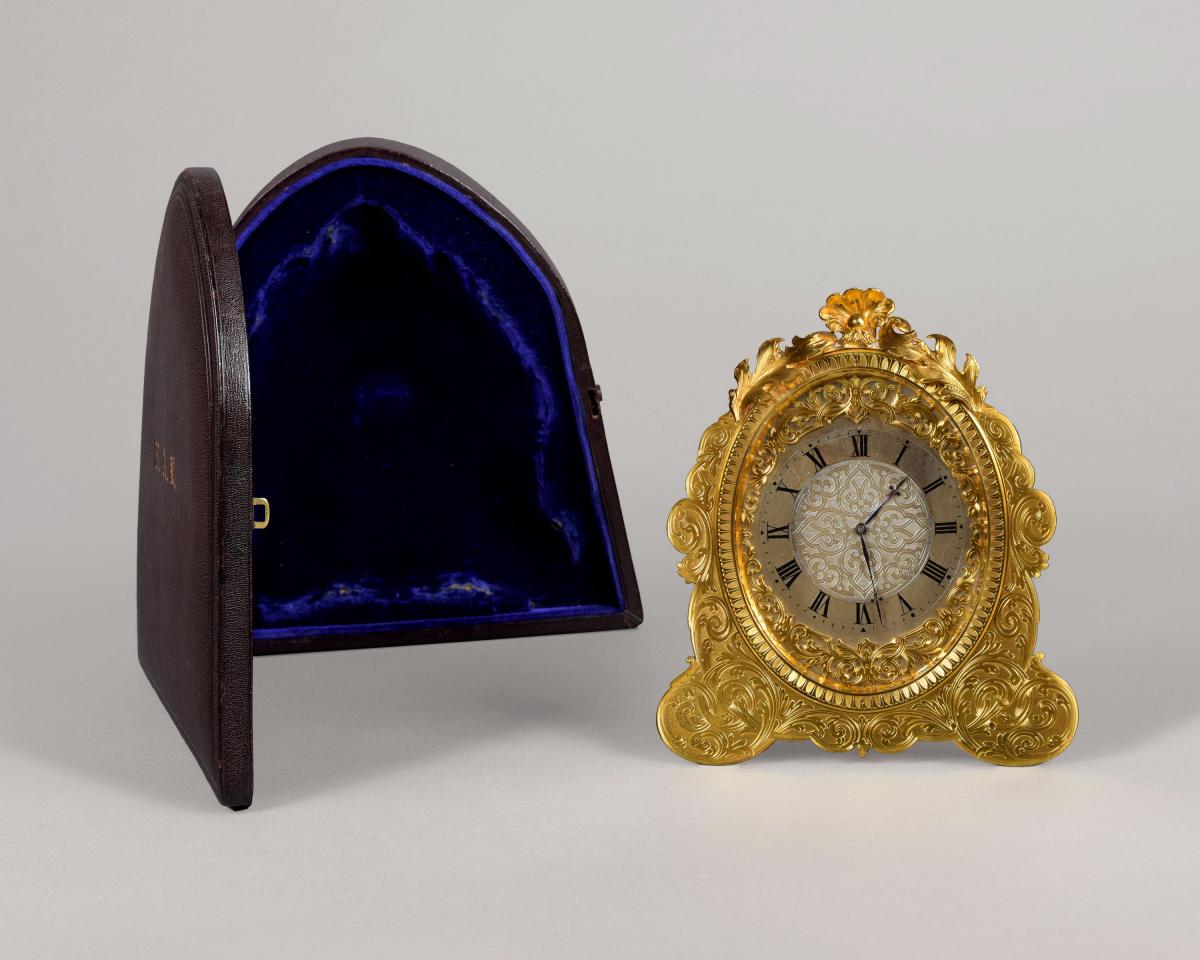 Victorian period gilt engraved oval strut timepiece