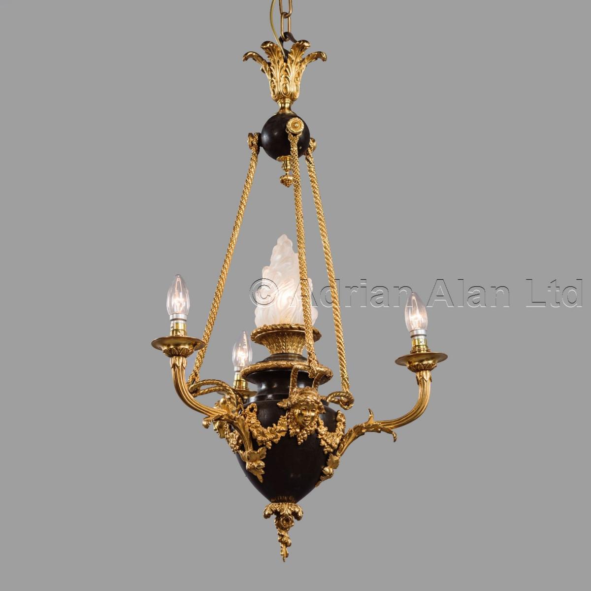 A Louis XVI Style Gilt and Patinated Bronze Four-Light Chandelier ©AdrianAlanLtd