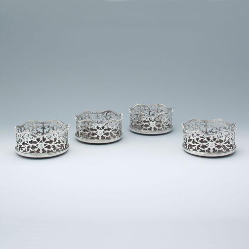 A Set of Four George III Antique English Silver Wine Coasters