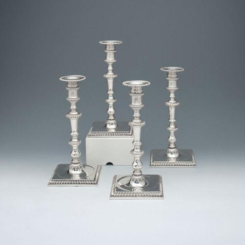 A Set of Four George II Antique English Silver Candlesticks