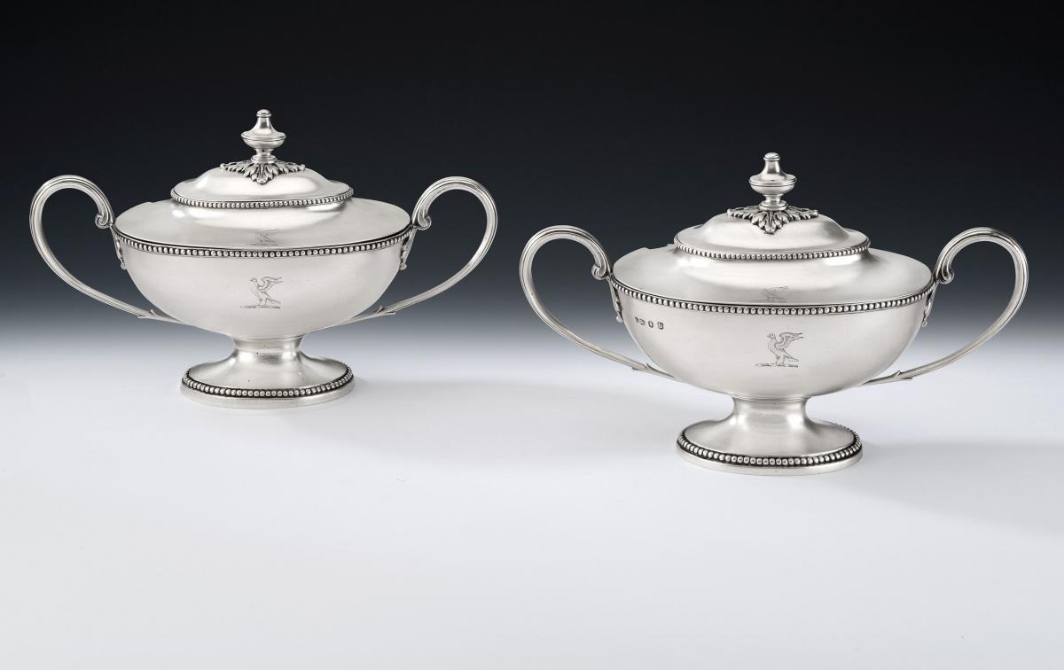 A very fine pair of George III Neo Classical Sauce Tureens and Covers. Made in London in 1777 by Thomas Evans.