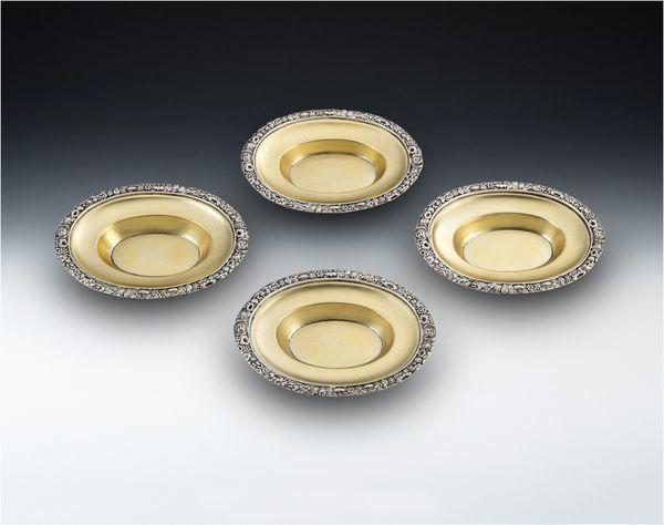 A very fine and rare set of four George III Silver Gilt Dishes made in London in 1817 by Solomon Royes and John East Dix.