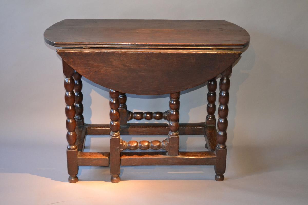 An unusual 17th century oak gateleg tavern table