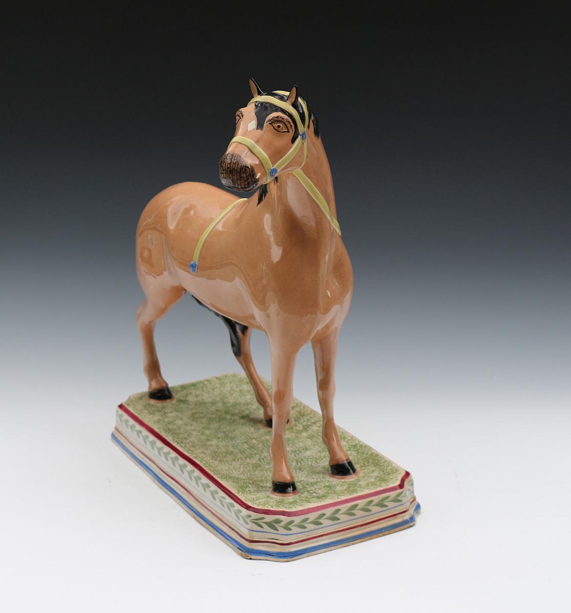 Antique pearlware pottery figure of a horse attributed to the Leeds Pottery early 19th century