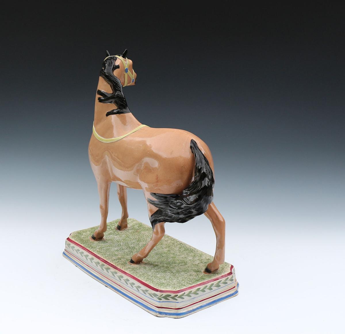 Antique pearlware pottery figure of a horse attributed to the Leeds Pottery early 19th century