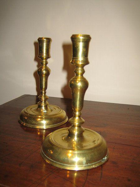 A good pair of mid-18th century brass candlesticks