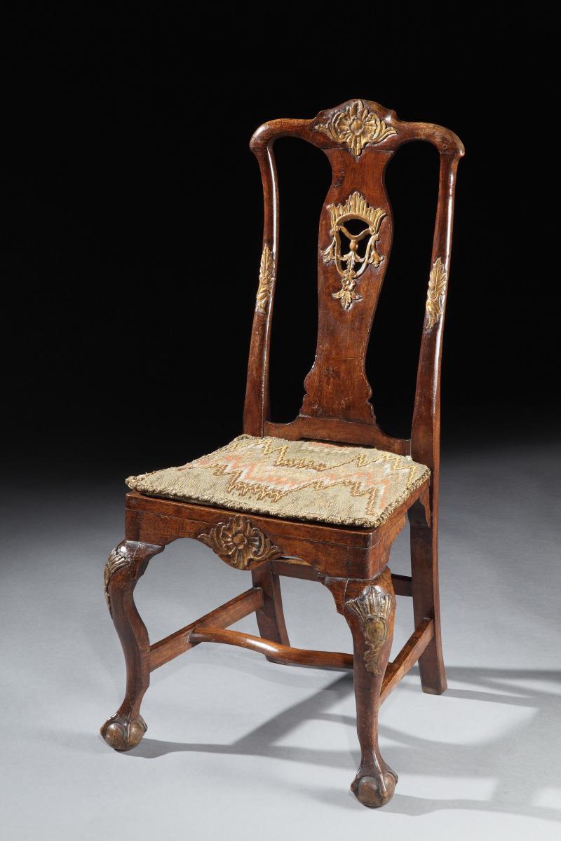 A rare, set of four, mid-18th century, Portuguese, parcel-gilt & walnut side chairs