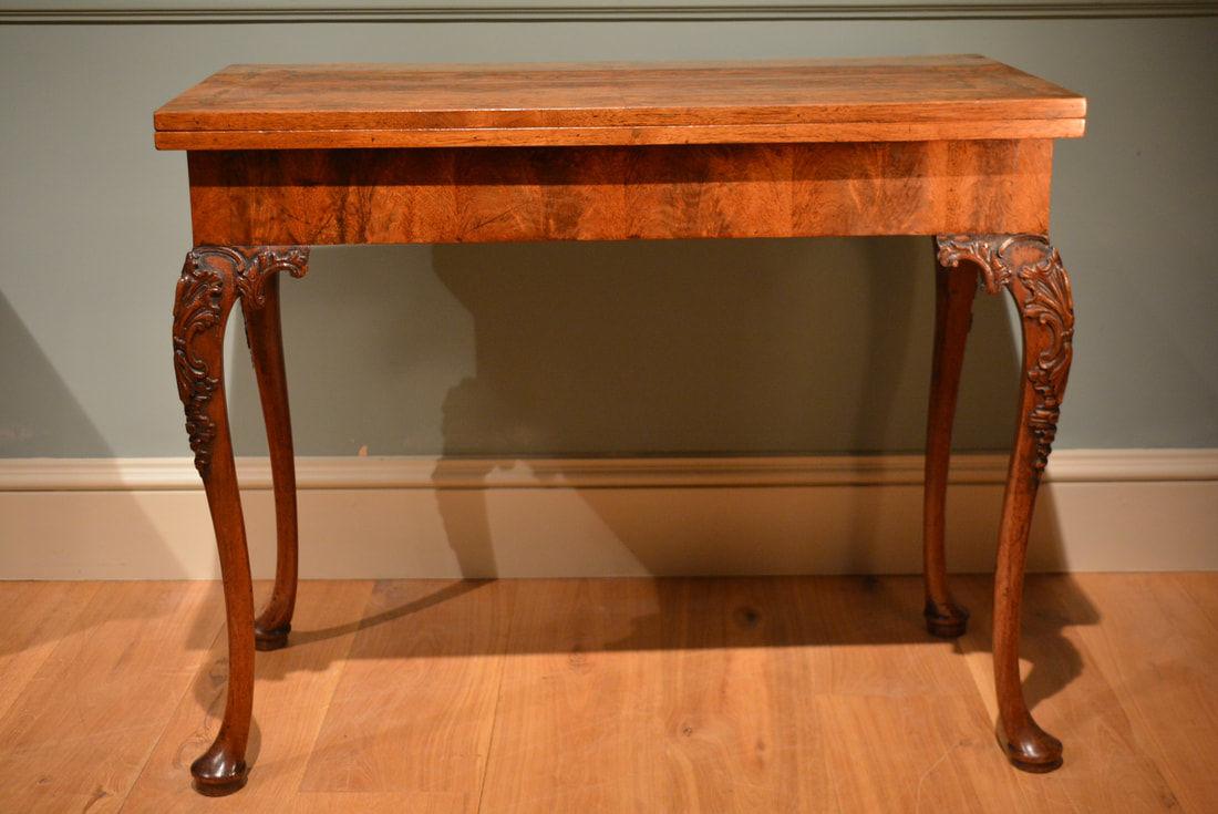 A fine George II walnut concertina action card table