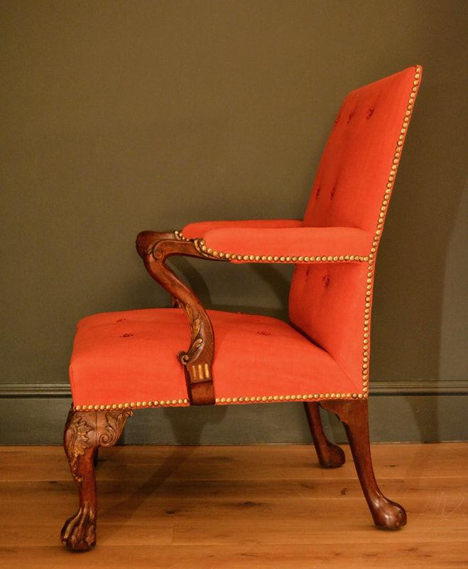 A carved mahogany parcel gilt Gainsborough chair