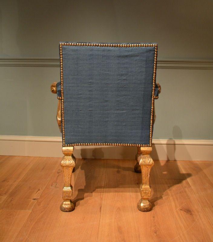 A George II carved giltwood armchair 