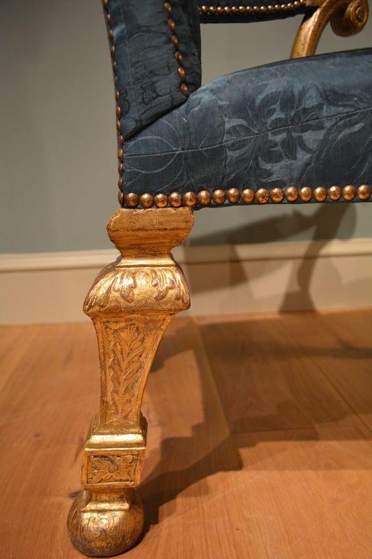 A George II carved giltwood armchair 