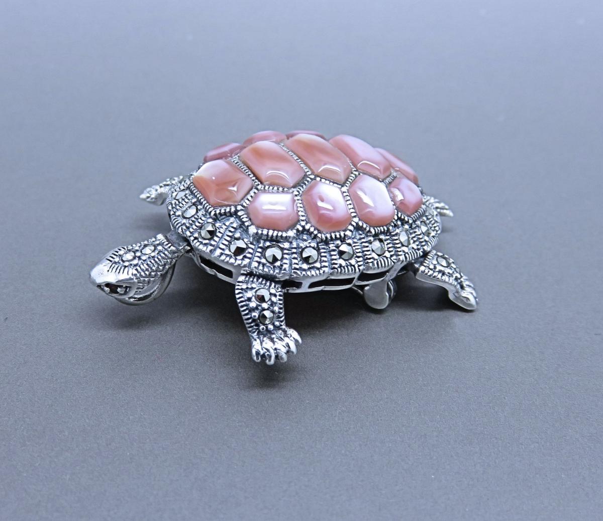 A Marcasite and Pink Mother of Pearl Brooch