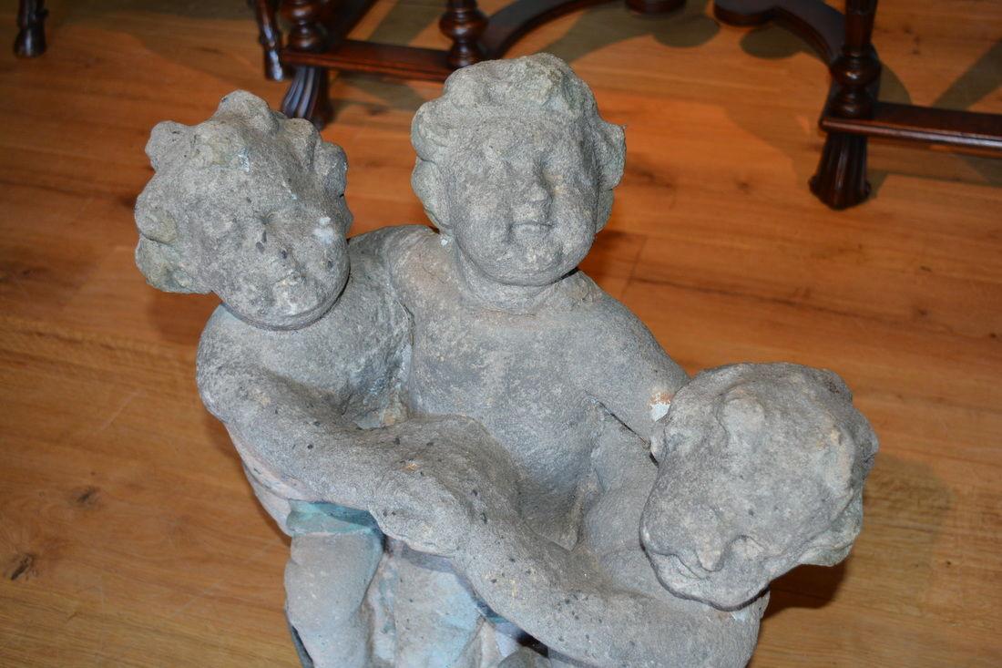 Early 18th Century stone group of three 'boyes'