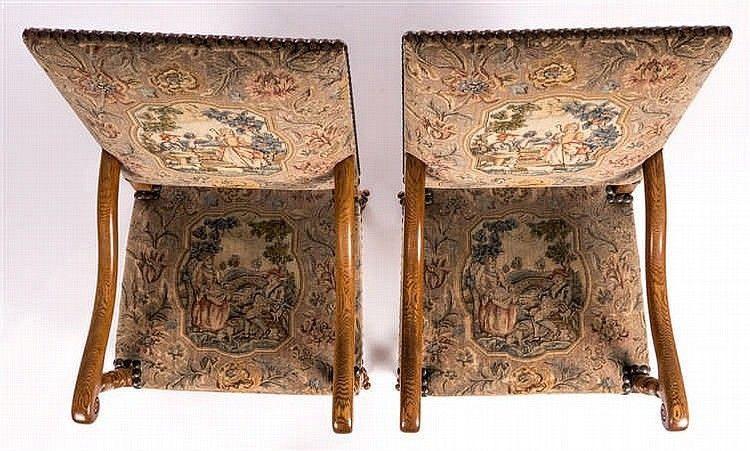 A pair of antiquarian, Louis XIII inspired, walnut open armchairs