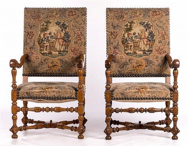 A pair of antiquarian, Louis XIII inspired, walnut open armchairs