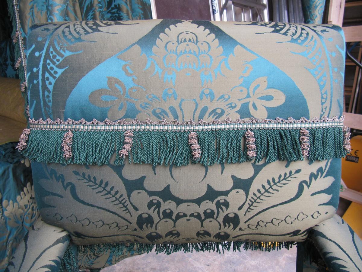A 19th century ‘ X ‘ chair, re-upholstered in a green, silk damask 