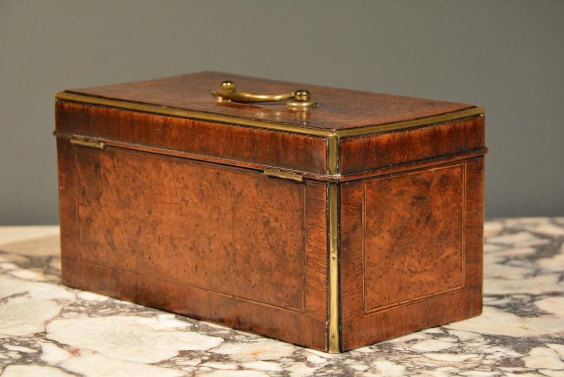An early 18th Century walnut brass mounted tea caddy