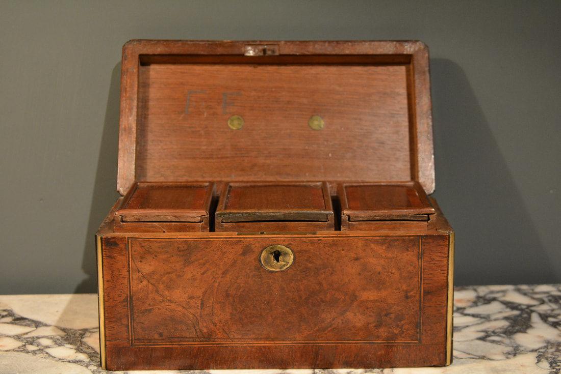 An early 18th Century walnut brass mounted tea caddy
