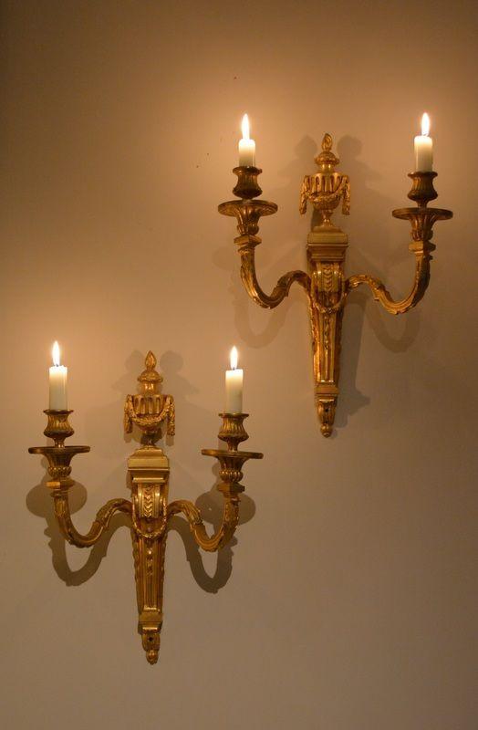 A pair of French neo-classical two light candle sconces.
