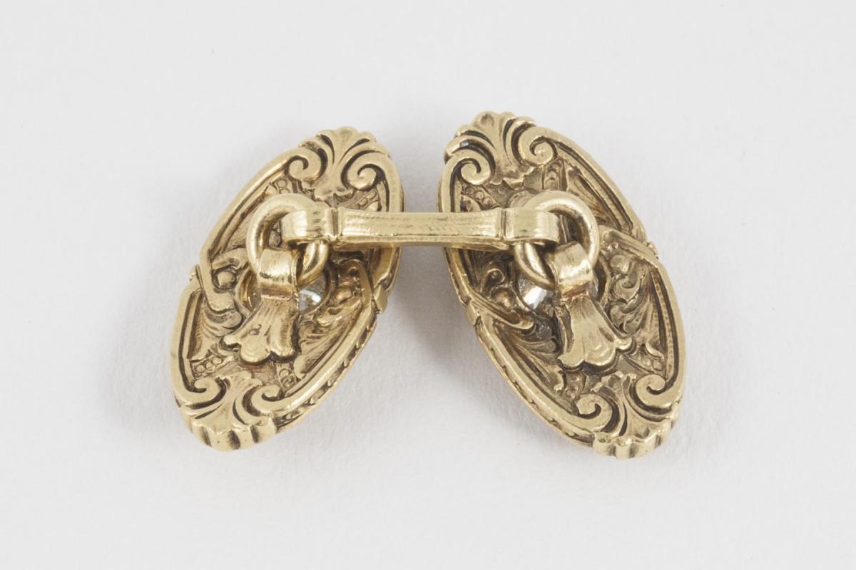 Cufflinks with Carved Scrolls in 14 Karat Gold with Central Diamond, American circa 1920