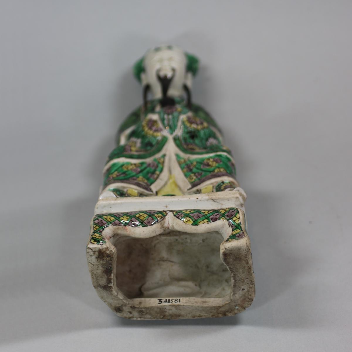  Chinese seated biscuit figure of a court official, Kangxi (1662-1722)