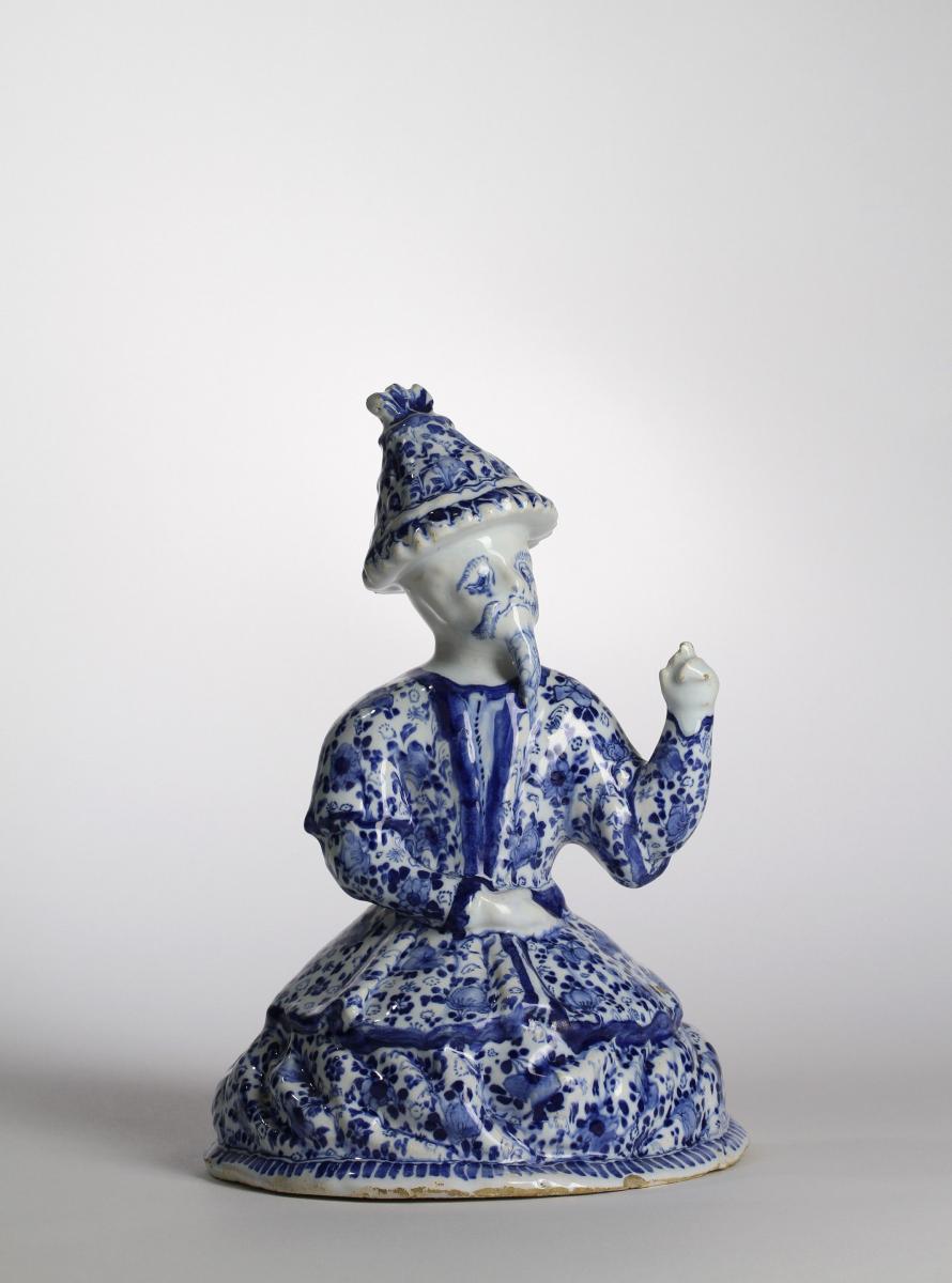 A Berlin Blue and White Faience Figure of a Chinaman, Gerhard Wolbeer’s Factory