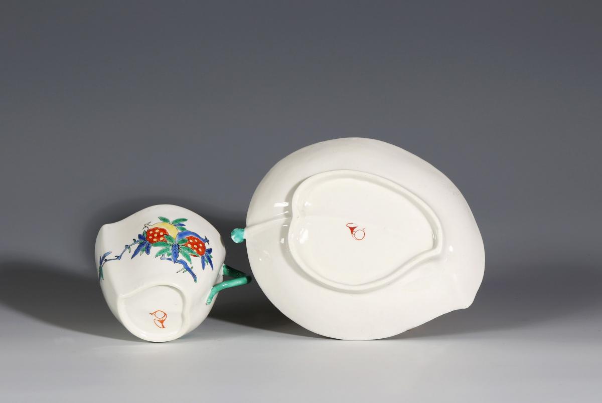 A Chantilly Kakiemon Peach-Shaped Cup and Saucer