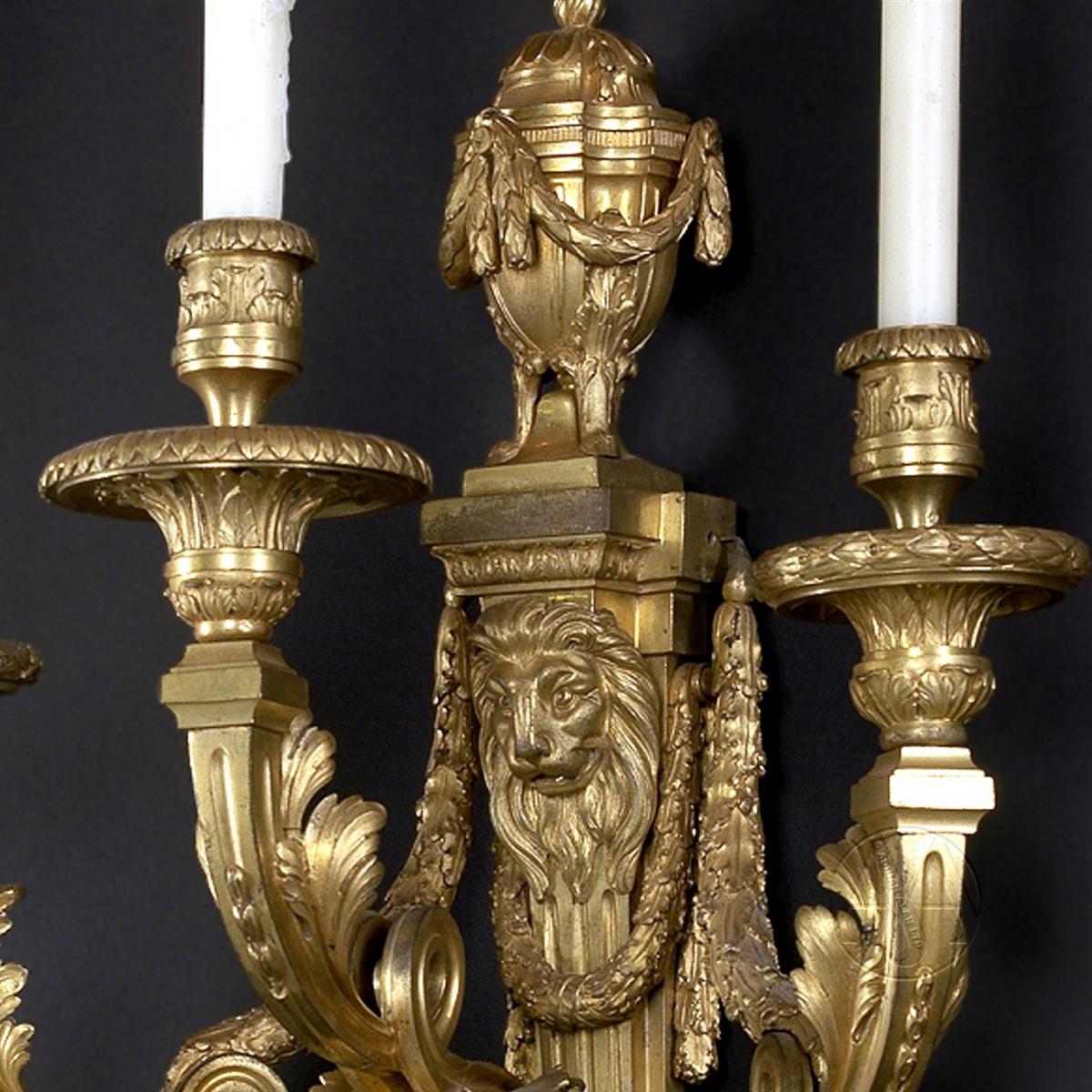 A Set of Four Large Louis XVI Style Three Branch Wall Appliques