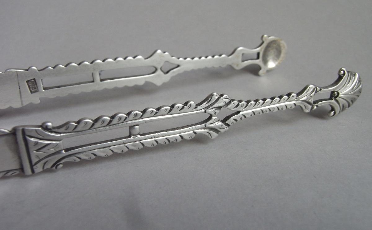 A fine pair of early George III Cast Sugar Tongs made in London circa 1765 by Charles Hougham