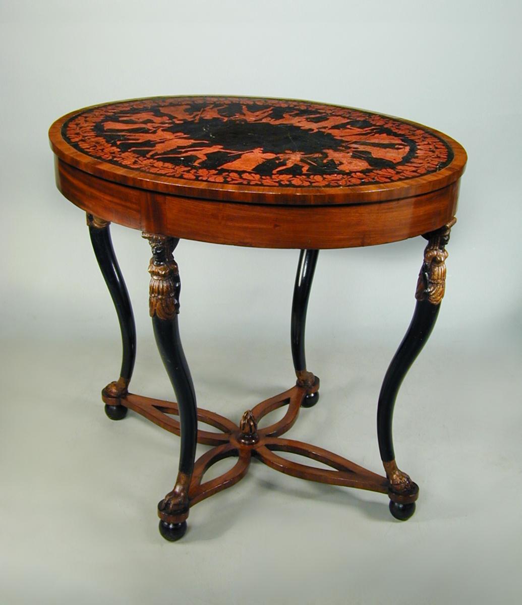 An unusual Italian neo-classical oval mahogany centre table