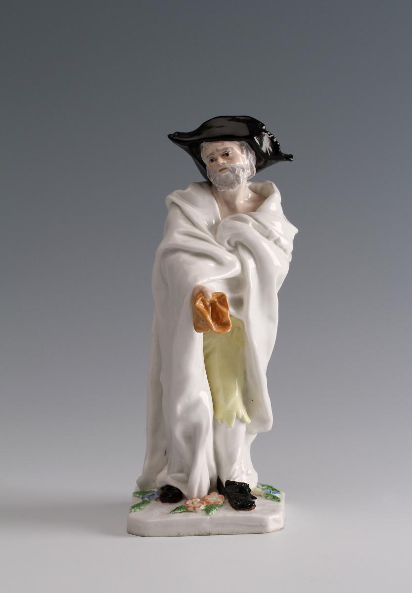 A Chelsea figure of an Italian Beggar; modelled by Joseph Willems
